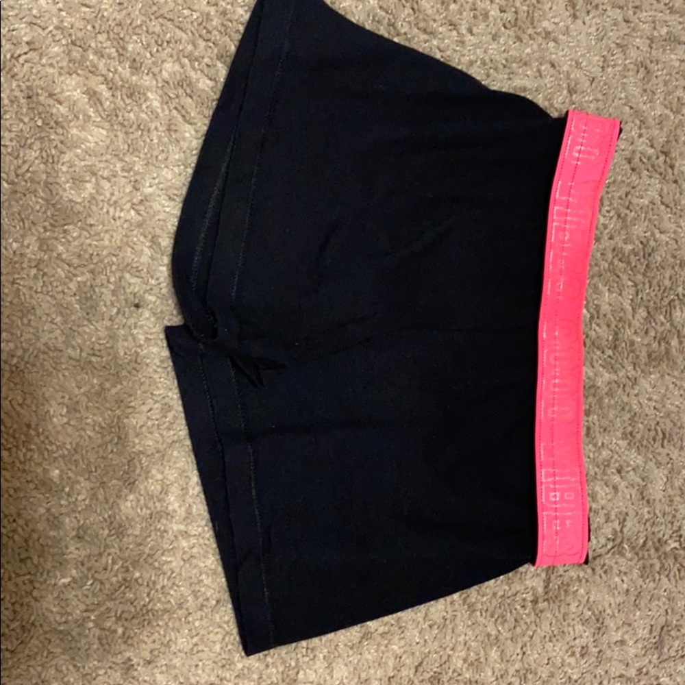 black shorts with pink good vibes band
